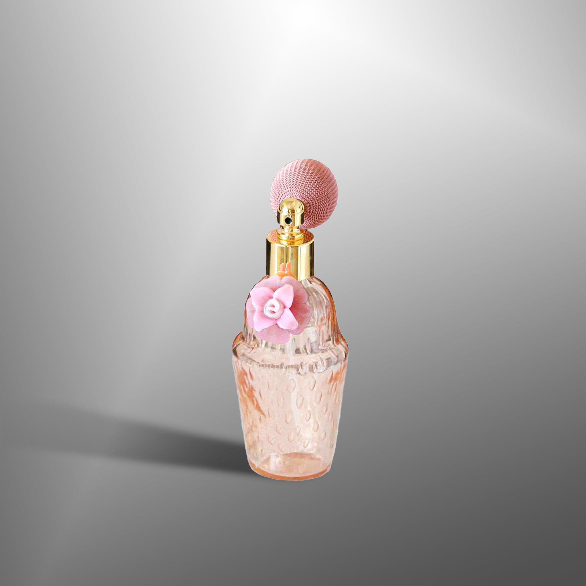 Parfume bottles in with Pink flowers