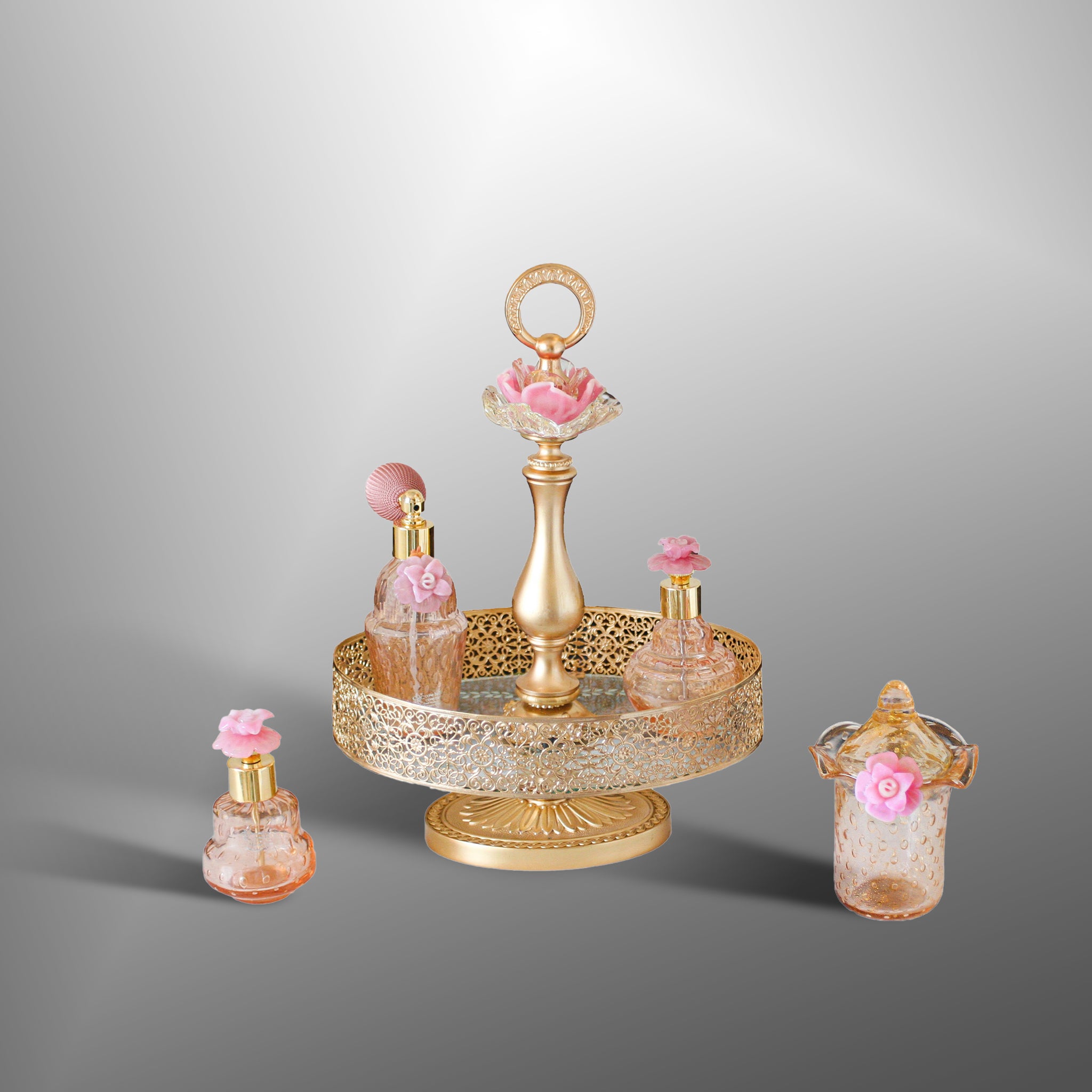 Parfume bottles in with Pink flowers
